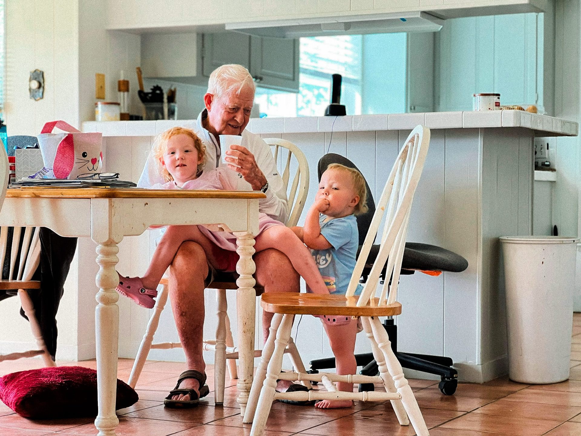 photo of Ellie and Emmie with Grandpa Sonny over Easter