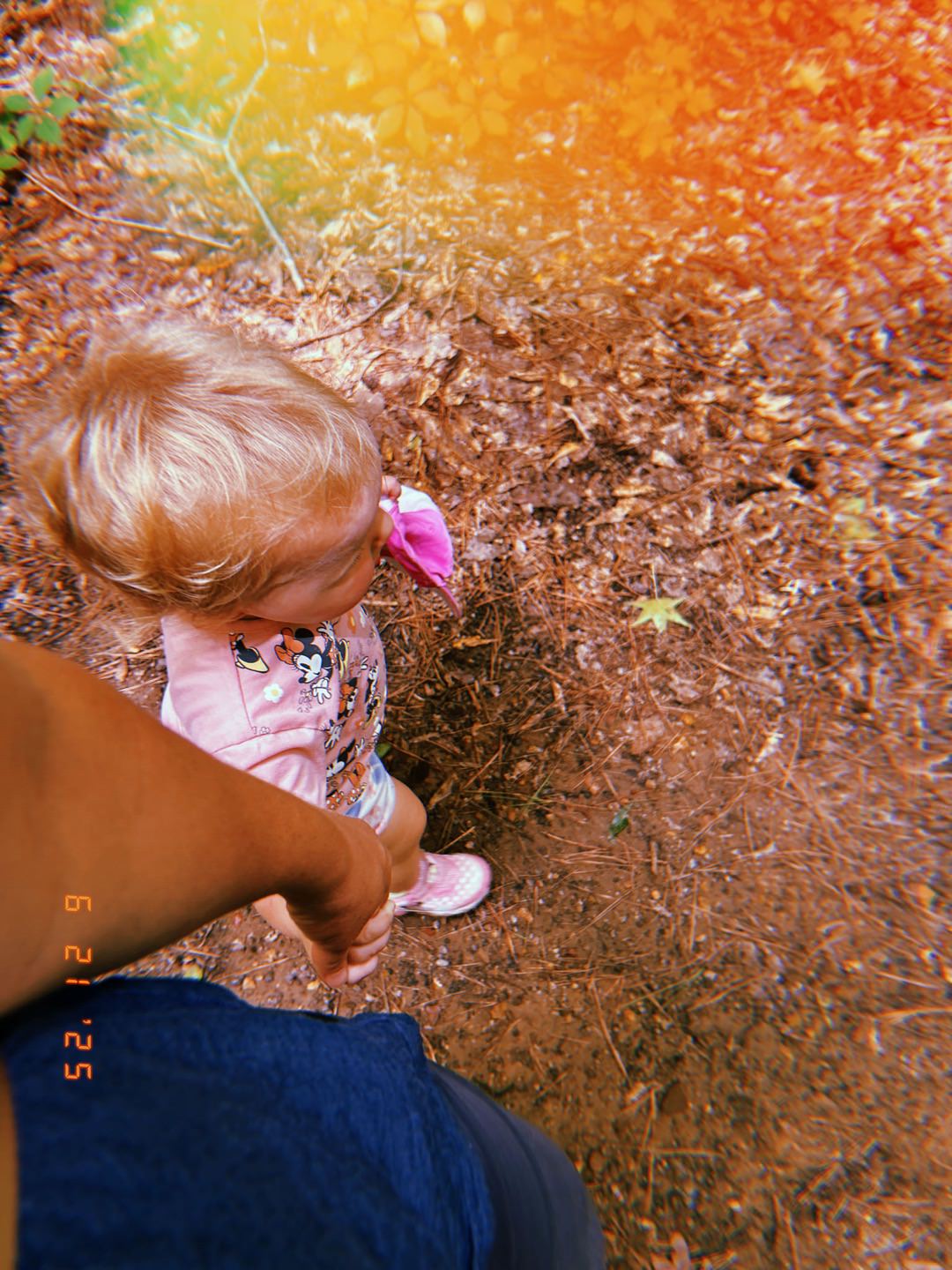 photo of Emmie holding Jen's hand on a hike Red Mountain Park