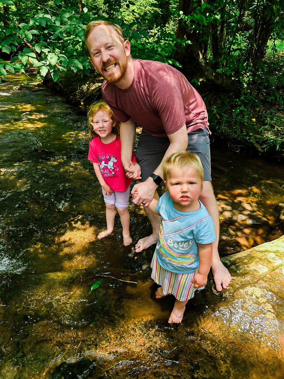photo of Josh with Ellie and Emmie at a creek in Birmingham