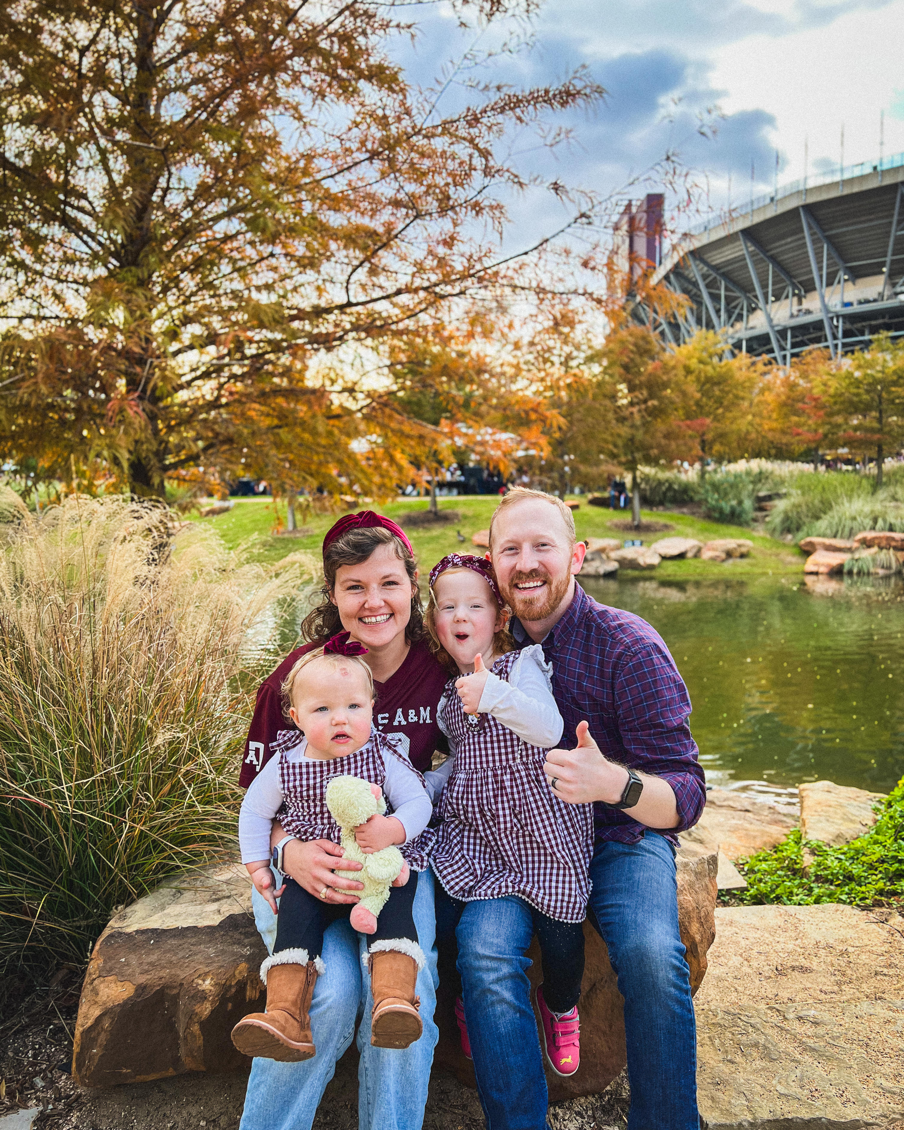 photo of Josh, Jen, Ellie, and Emmie in Aggie Park for the Lone Star Showdown football game